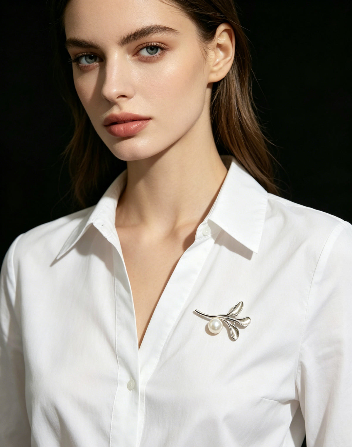 Sylva pearl branch brooch worn on white shirt