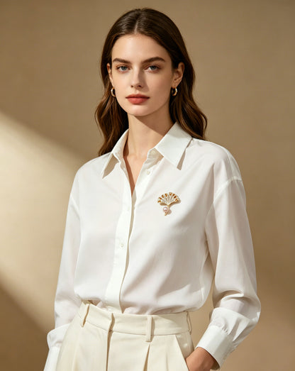 Ginkgo Rose pearl fan brooch worn on white shirt