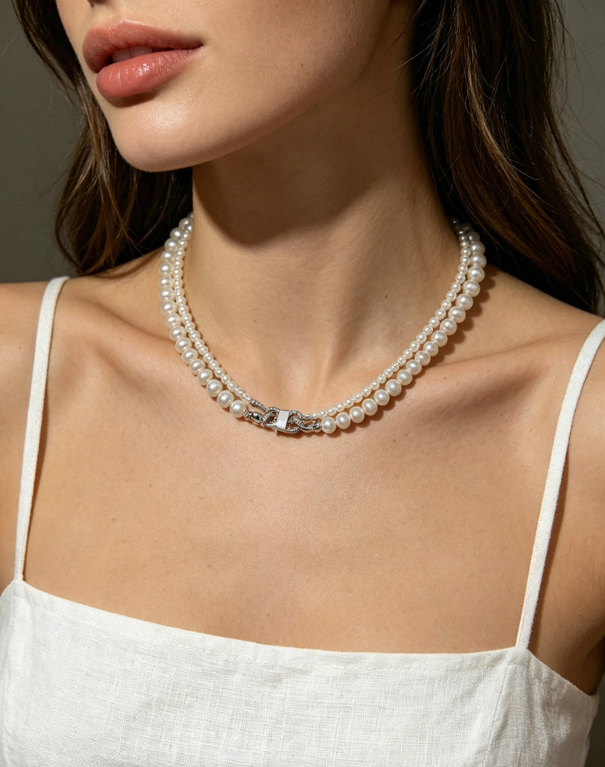 Model wearing VARI Celeste double-strand white freshwater pearl necklace