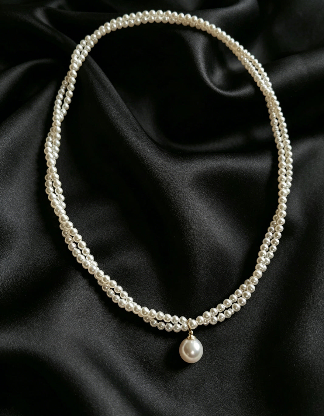Celine twisted seed pearl drop necklace