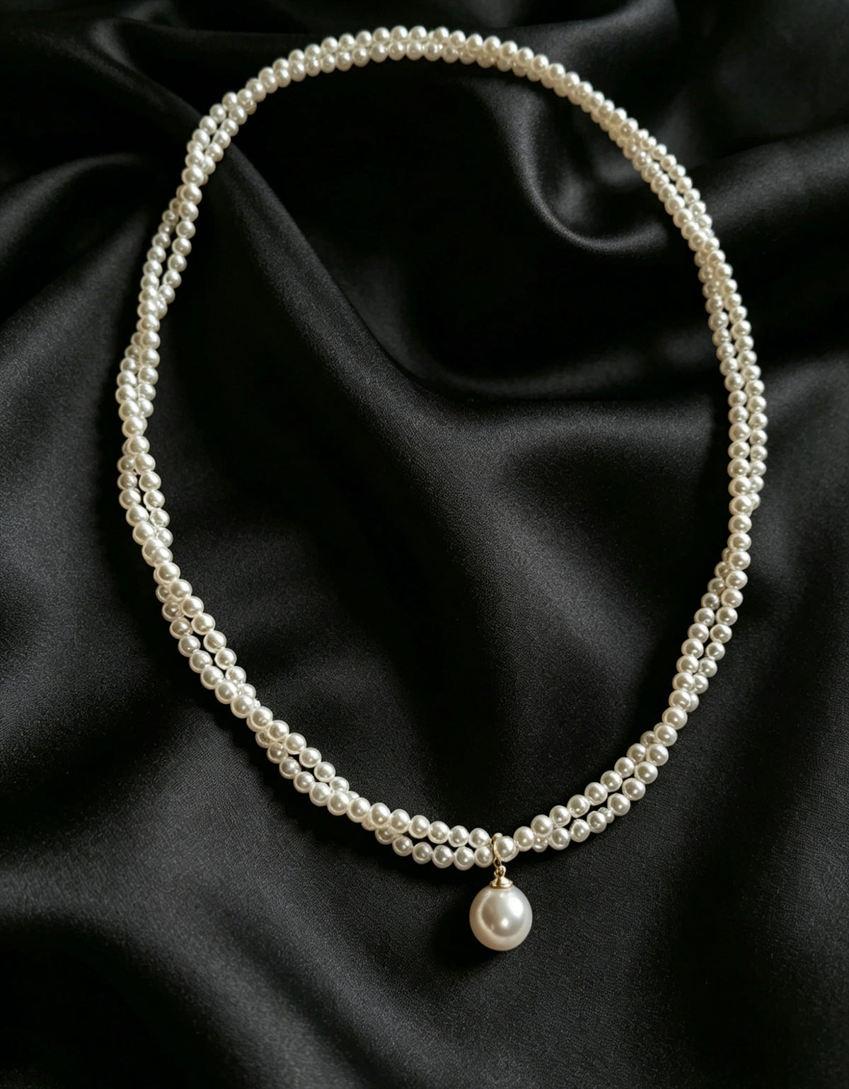 Celine twisted seed pearl drop necklace