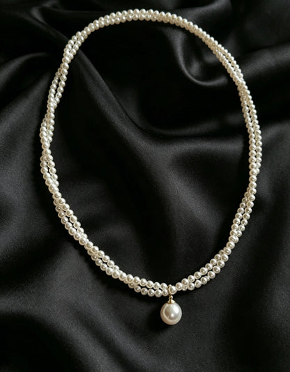 Celine twisted seed pearl drop necklace