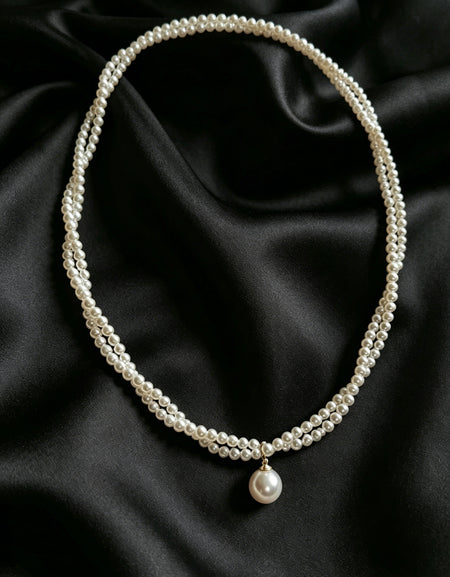 Celine twisted seed pearl drop necklace