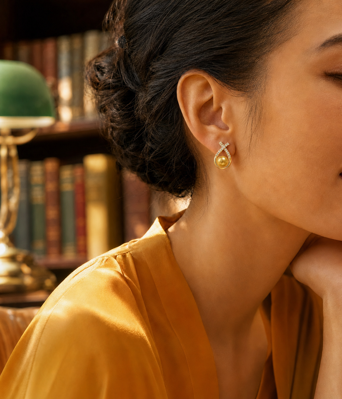 Lucky Charm Golden South Sea Pearl Earrings with species-correct pearl color on model