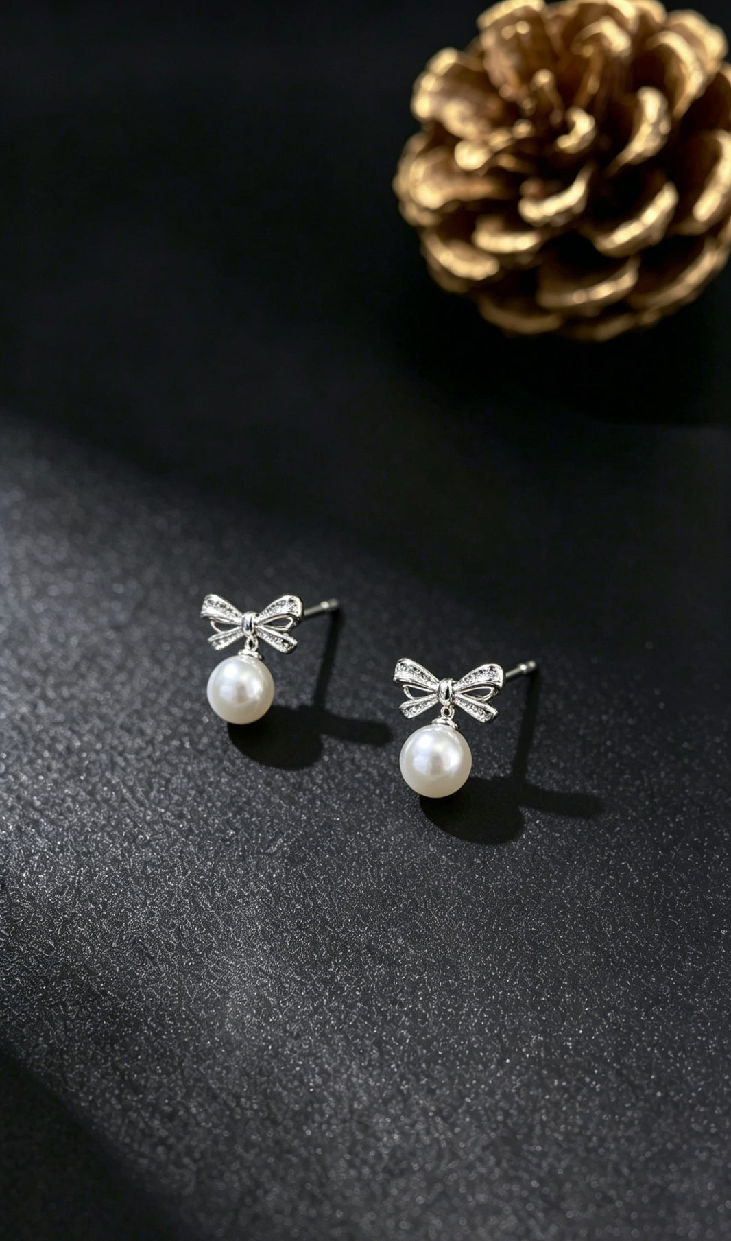 Odette white pearl bow drop earrings product view
