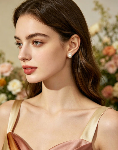 Mirelle white pearl teardrop halo stud earrings worn view