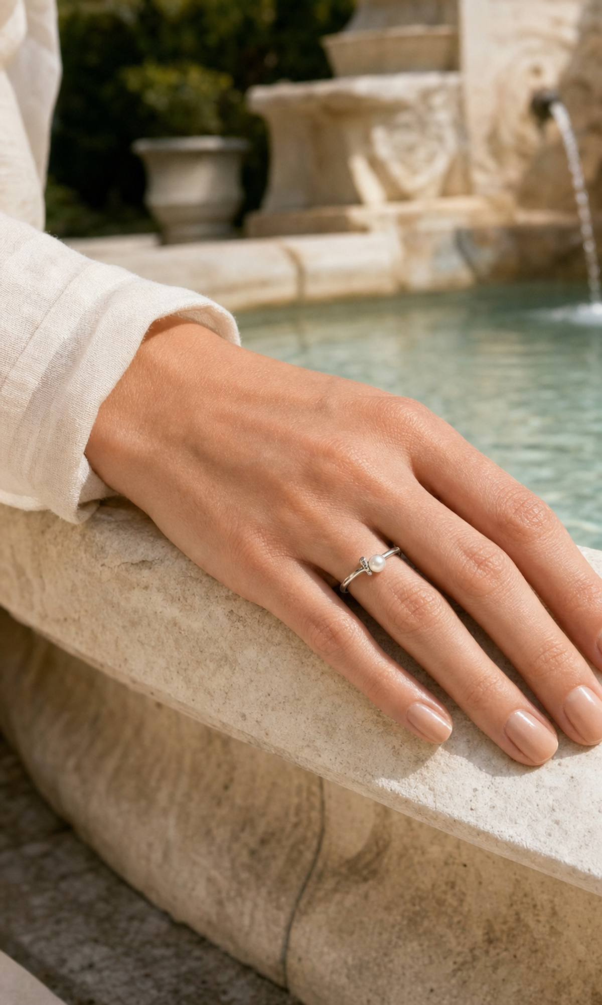 Minuet Freshwater Pearl Loop Ring worn in a lifestyle setting
