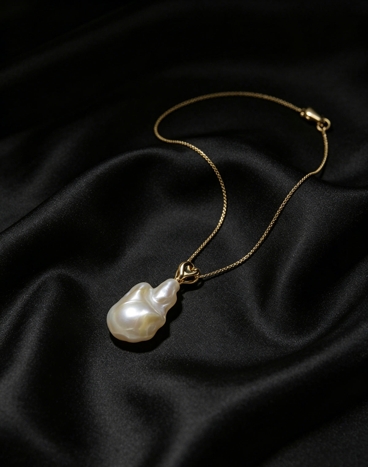 Fleur white baroque pearl crown pendant on model