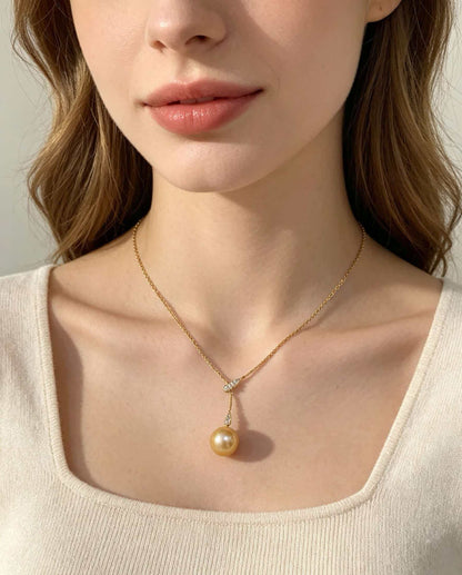 VARI Mermaid supplemental image from lorelei-11-12mm-golden-freshwater-pearl-lariat-pendant 2