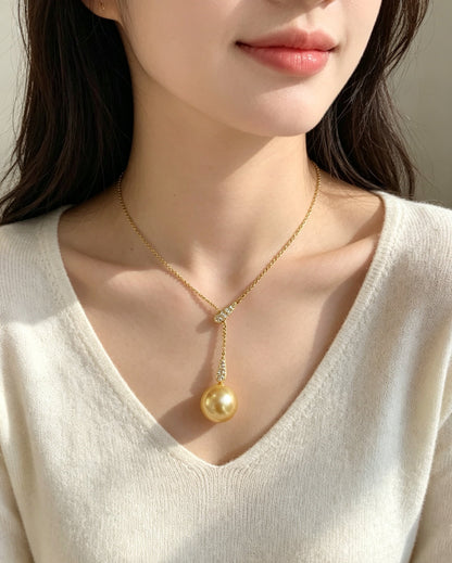 VARI Mermaid supplemental image from lorelei-11-12mm-golden-freshwater-pearl-lariat-pendant 3
