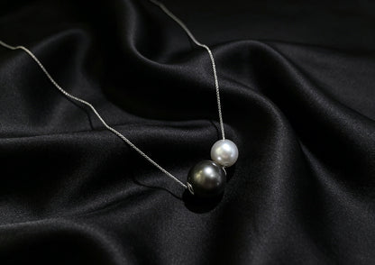 VARI Round Starlight supplemental image from nyx-12-16mm-white-black-double-freshwater-pearl-slider-pendant 1