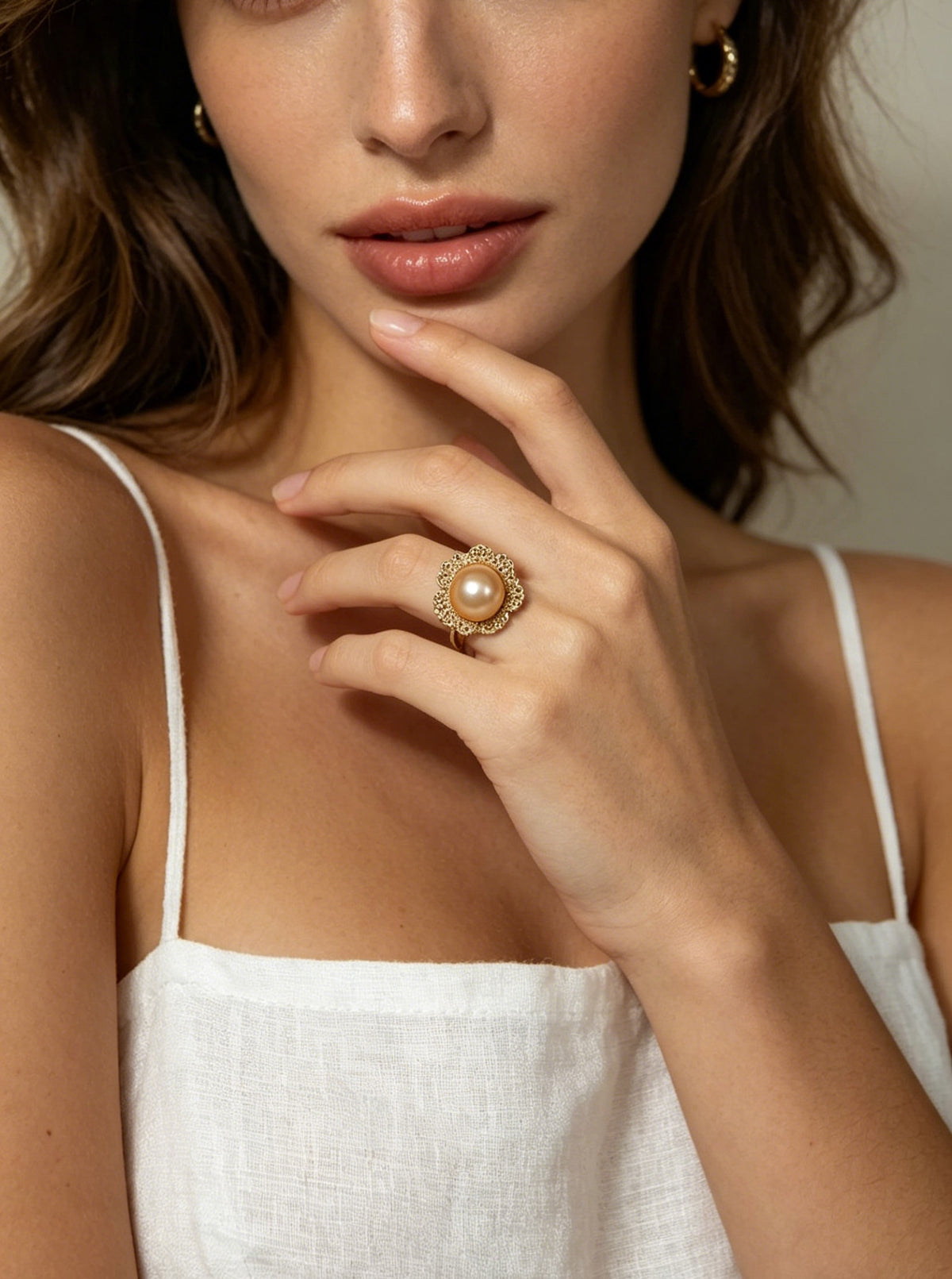 Solara golden pearl halo ring worn