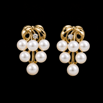 Roselle Cluster white freshwater pearl earrings on matte black background