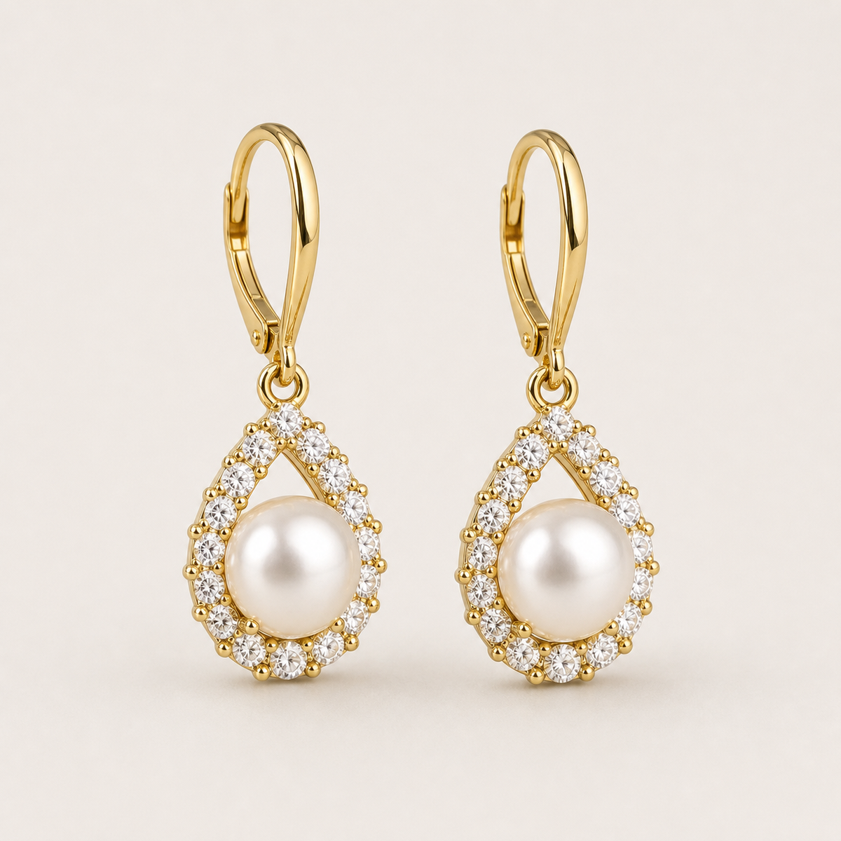 Teardrop white freshwater pearl and cubic zirconia halo earrings